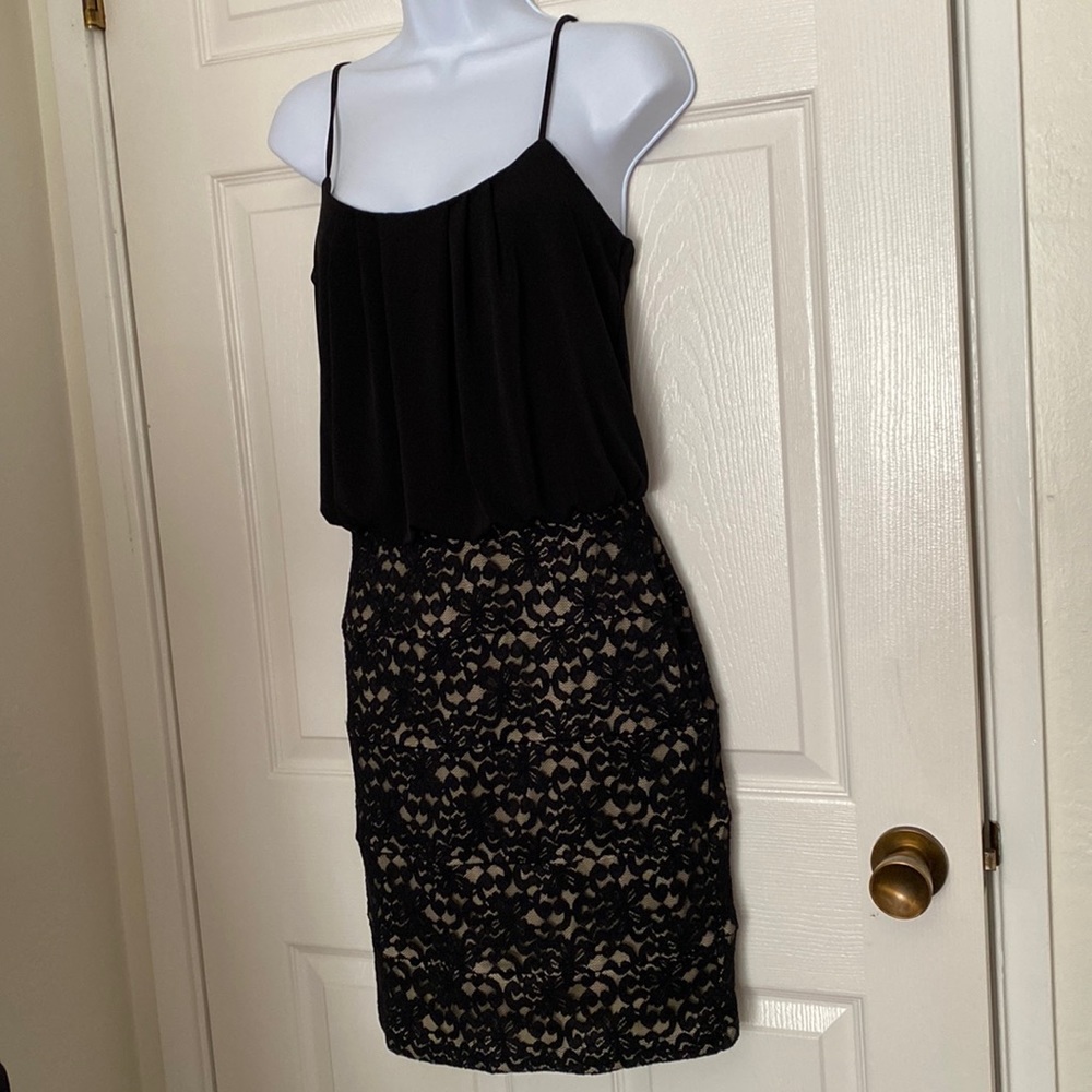 Black dress with a neutral fabric and lace covering. Size 8 Focus Studio.